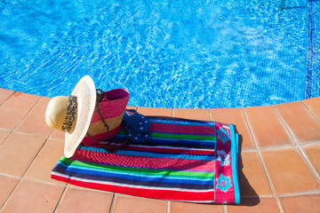 towel and bathing accessories near pool