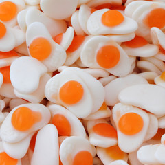 Fried eggs sweets as background