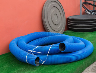 Blue thick hose on a green background