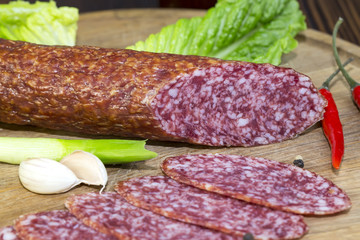 sausage on a wooden plate in a restaurant
