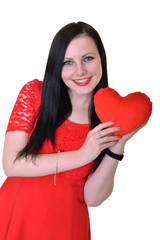 Attractive young woman red heart-shaped pillow.