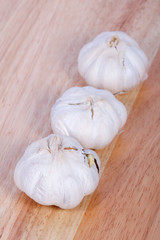 Organic garlic whole on the wooden background