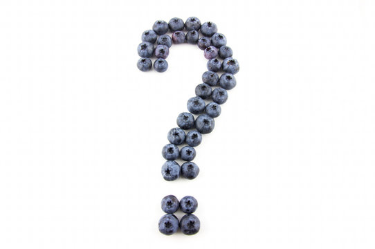 Question mark made of fresh blueberries