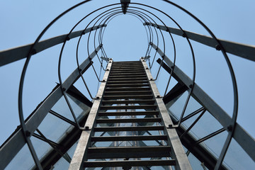 Fire escape ladder on a building office, iron staircase, abstrac