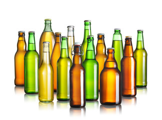 Collection of beer bottles without labels isolated on white