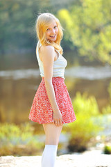 Portrait of lovely young woman in summer park