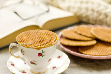 Syrup waffle warming on top of a teacup