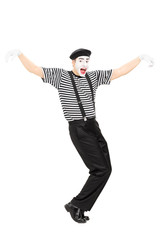 Fototapeta na wymiar Happy mime artist dancing