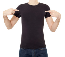 Man pointing at black t-shirt on white, clipping path