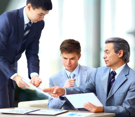 Business team interviewing young applicant