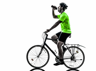 Fototapeta na wymiar man bicycling mountain bike drinking silhouette