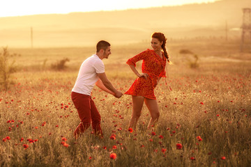 Couple in the poppy field