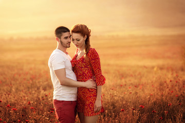 Couple in the poppy field