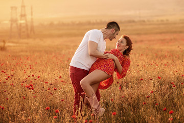 Couple in the poppy field