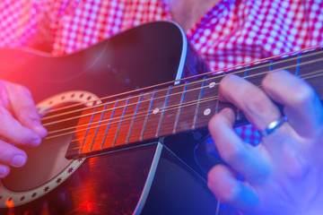 Obraz na płótnie Canvas Male Musician with a acoustic Guitar