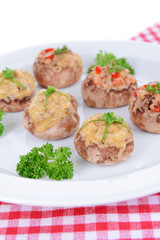 Stuffed mushrooms on plate on table close-up