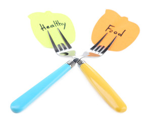 Note papers with messages attached to forks, isolated on white