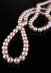 Beautiful pearls on black background