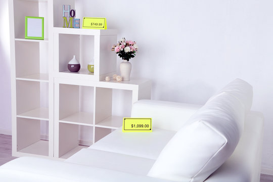 New white furniture with prices on light background