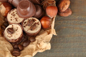 Tasty chocolate candies with coffee beans and nuts