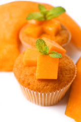 Tasty pumpkin muffins, isolated on white