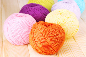 Knitting yarn on wooden background