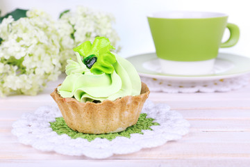 Tasty cake on table on light background