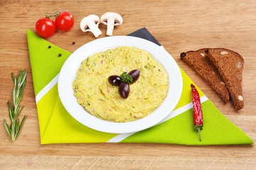 Bowl of tasty fresh hummus, close up