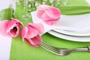 Table setting with spring flowers close up
