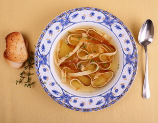 Pancake soup in blue plate with bread