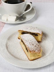 Bun filled with poppy seeds served with coffee