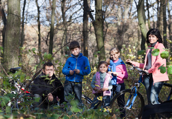 Family portrait with bicycles outdoors