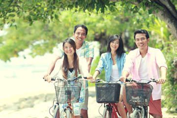 friends having fun riding bicycle together