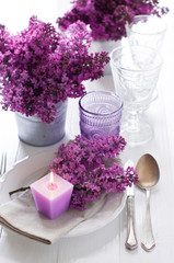 Obraz na płótnie Canvas table setting with lilac flowers