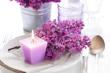 Fototapeta na wymiar table setting with lilac flowers