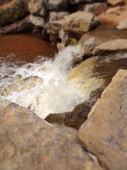 Tilt-shift picture of a powerful waterfall