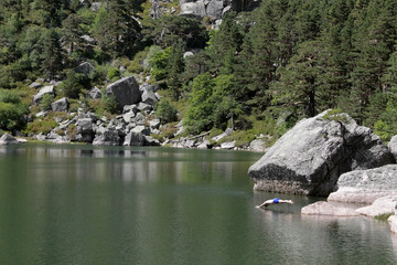 Man jumping into a lake