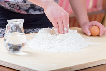 Girl is mixing the water and flour
