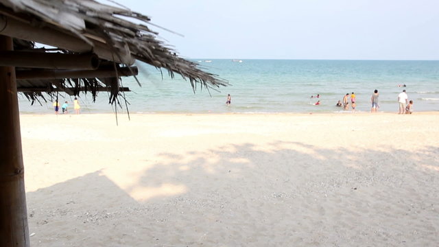 small huts and people on the beach