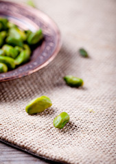 Pistachio nuts in a cooper authentic plate