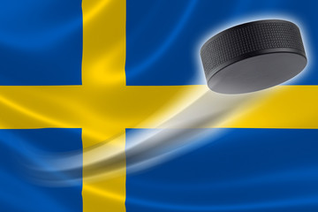 Hockey Puck Streaks Across Sweden's Flag