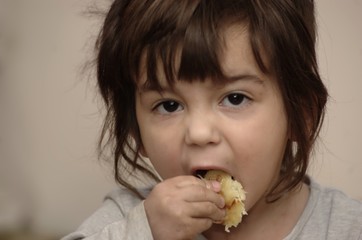Little boy eating pancake