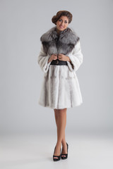 Young Beautiful Woman In a Fur Coat