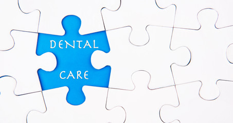 Fototapeta premium Missing puzzle revealing the DENTAL CARE words