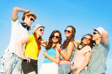 group of young people wearing sunglasses and hat