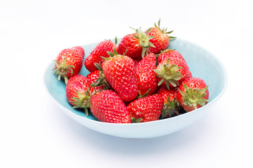 Fresh strawberries in bowl isolated on white background