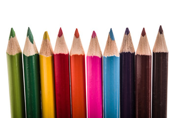 row of pencil colors on a white backgroiund