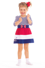 Charming little girl posing in studio.