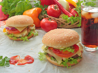 Hamburgers with fresh vegetables and cold cola