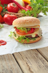 Closeup of homemade hamburger with fresh vegetables